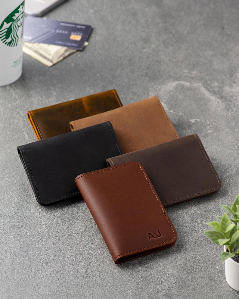 Man opening the ID window wallet to show card capacity