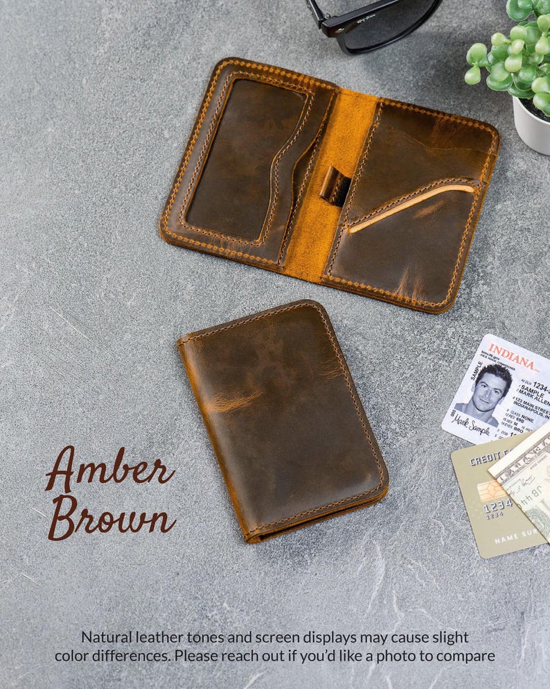 Slim zip-around leather wallet shown folded at a 360° angle on gray background