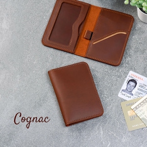 Cognac leather slim wallet open to show interior card layout