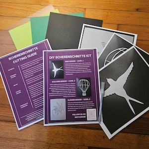 May include: A DIY Scherschnitt kit with a cutting guide, various coloured paper sheets, and black and white paper cutouts. The kit includes designs for a bird, balloon, and flower. The text on the guide says "Scherschnitt Cutting Guide".