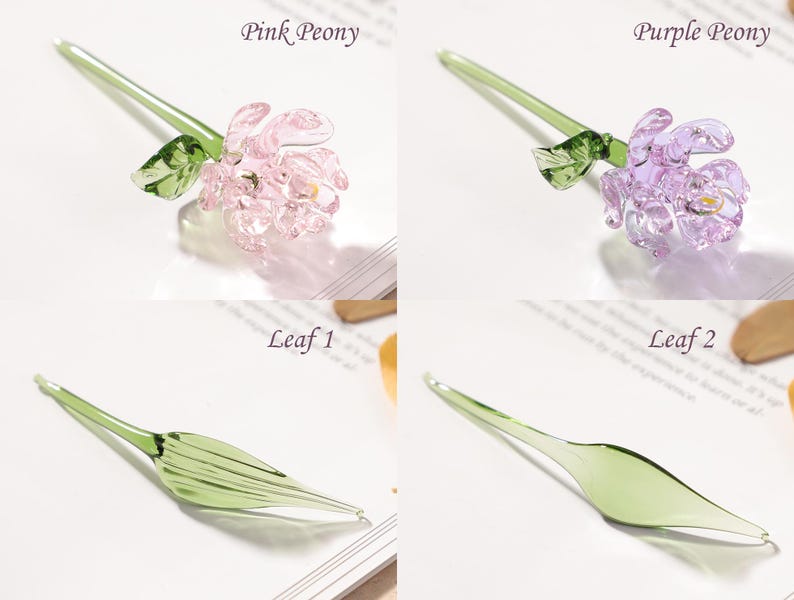 May include: Glass flower pens in pink and purple peony designs, and green leaf designs. The pens have a delicate, handcrafted appearance. The text "Pink Peony", "Purple Peony", "Leaf 1", and "Leaf 2" are visible.