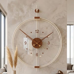 May include: A circular wall clock featuring a transparent face with brown numerals at 3, 6, 9, and 12 o'clock. The clock has a white frame, brown hands, and a central brown circular hub. A vertical white rod extends above and below the clock frame.
