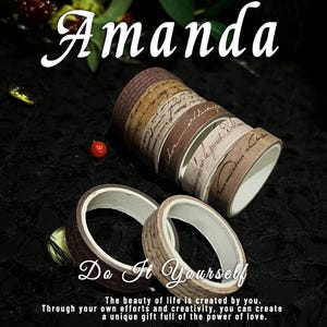 May include: Decorative washi tape rolls in shades of brown and beige with script and patterned designs. The word "Amanda" is written in cursive at the top, with "Do It Yourself" below. The text "The beauty of life is created by you" is also visible.
