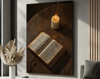 May include: A framed print featuring a lit candle and an open book on a dark wooden surface. The book is open, displaying text, and the candle flame glows brightly. The scene evokes a sense of peace and contemplation.