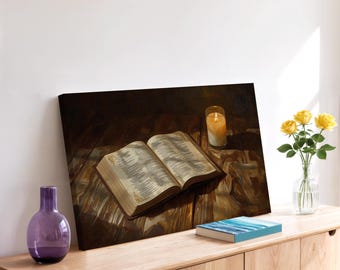 May include: An open book with gold-edged pages sits on a wooden surface, lit by a candle in a glass holder. A vase of yellow roses and a purple vase are also on the wooden surface. A small book with a blue cover is also on the surface.