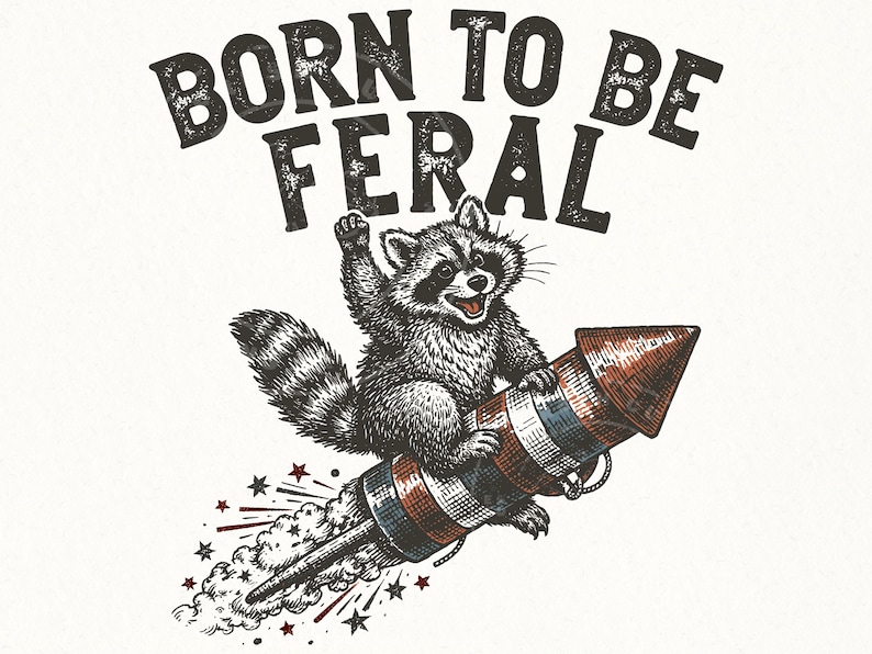 May include: A black and white illustration of a raccoon riding a red, white, and blue rocket. The text "BORN TO BE FERAL" is above the raccoon. Stars and smoke trails are also included in the design.