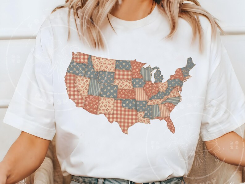 May include: White t-shirt featuring a patchwork design of the United States map. The map is composed of various patterns in red, blue, and beige, including stars, stripes, and floral prints. The shirt is a casual, everyday wear item.