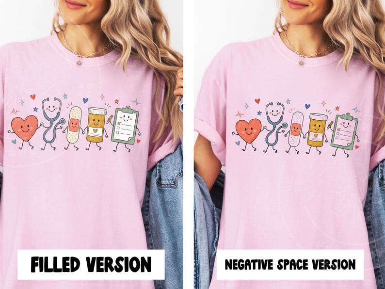 May include: A light pink t-shirt featuring a graphic print of five anthropomorphic medical items holding hands: a heart, a stethoscope, a bandage, a pill bottle, and a clipboard. The design includes small colorful hearts and star accents.
