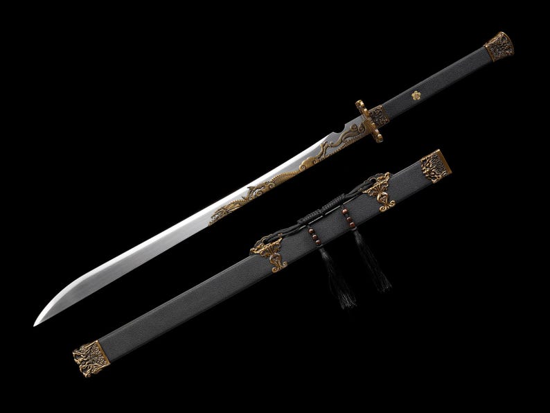May include: A long, silver sword with a black handle and scabbard. The blade has ornate gold detailing, including a dragon design. The scabbard is black with gold accents and tassels. The sword is displayed against a black background.