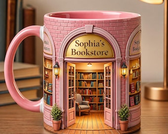 May include: Pink ceramic mug featuring a bookstore design. The mug has a handle and is decorated with a miniature bookstore facade, complete with a door, bookshelves, and the text "Sophia's Bookstore". The mug also has two small potted plants.