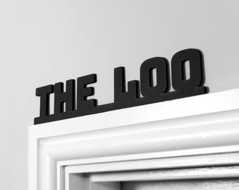 Letrero para puerta de baño o decoración de pared, color negro