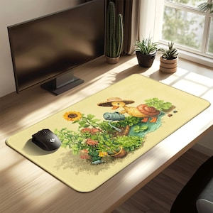 May include: A rectangular mousepad with a whimsical garden scene featuring a duck wearing a straw hat, a snail, and a sunflower. The mousepad has a light yellow background and a black mouse is on the left.