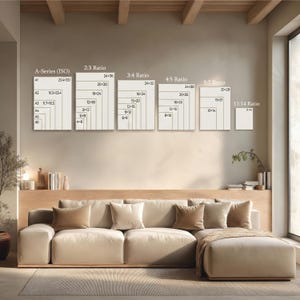 May include: A beige sectional sofa with several throw pillows and a blanket. Above the sofa, there are framed size ratio charts, including A-Series (ISO), 2:3, 3:4, 4:5, 5:7, and 11:14 ratios, with measurements in inches.