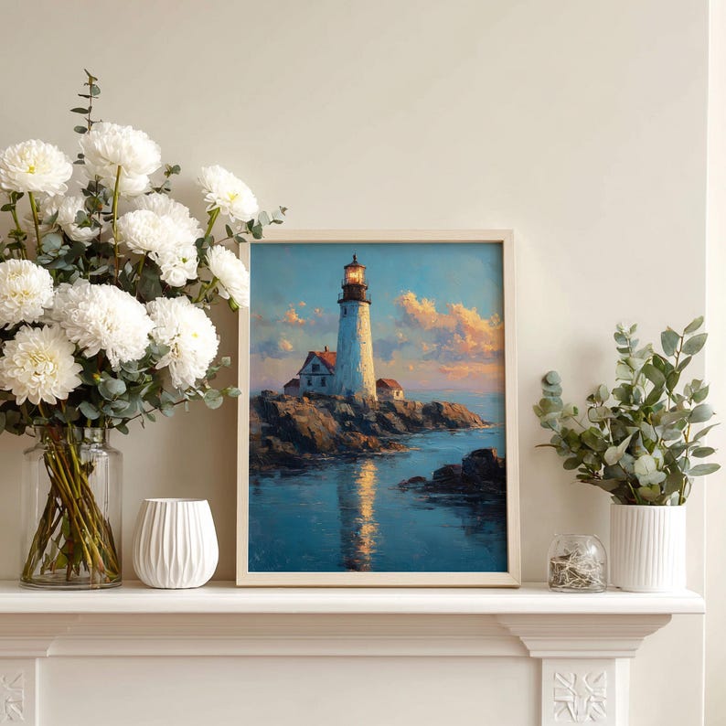 Portrait lighthouse sunset seascape print with warm lantern glow and golden reflection on calm blue water.