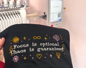 Focus Is Optional Chaos Is Guaranteed Embroidered Sweatshirt Hoodie Or Tee | Funny ADHD Shirt | Chaotic Energy Jumper | Cosy Unisex Pullover