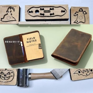 May include: An assortment of leather items and craft tools. Features a brown leather wallet, an open notebook with "FIELD NOTES" on the cover, and wooden die-cut shapes. A mallet and a metal tool are also present in the image.