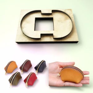 Puede incluir: Un troquel de madera para crear pequeños monederos de cuero, con un diseño de corte cuadrado y curvo. Se muestran varios monederos acabados en varios colores, incluyendo naranja, marrón y rojo, con cremalleras doradas. Un monedero se sostiene en una mano.