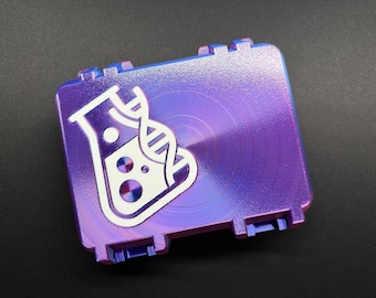 May include: A square, metallic case with a purple and blue iridescent finish. A white graphic of a flask and DNA strand is centered on the lid. The case has a ridged design and a clasp on each corner.