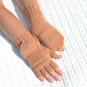 Light bown alpaca half finger convertible gloves with mitten flaps on model's hands