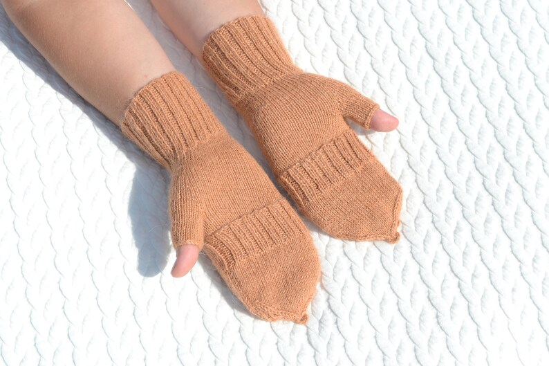 Light bown alpaca half finger convertible gloves with mitten flaps on model's hands