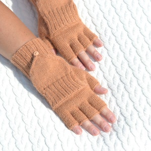 Light bown alpaca half finger convertible gloves with mitten flaps on model's hands