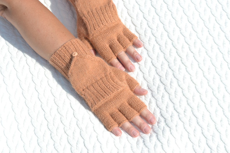 Light bown alpaca half finger convertible gloves with mitten flaps on model's hands