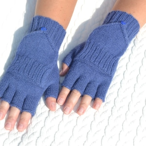 Hand knitted blue alpaca half finger mittens on model's hands