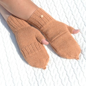 Light bown alpaca half finger convertible gloves with mitten flaps on model's hands