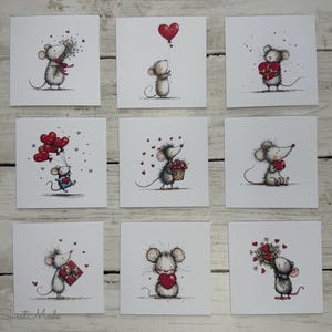 May include: Nine square cards with illustrations of mice holding hearts, balloons, and gifts. The mice are in various poses, with red hearts and accents. The cards are arranged on a light wood-grain surface. The text "Simply Sweet Made" is at the bottom.