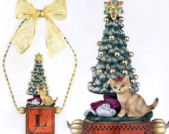 assemblage art,ornament mixed media,found object, cat, Christmas tree, mouse, toy block, wood block,