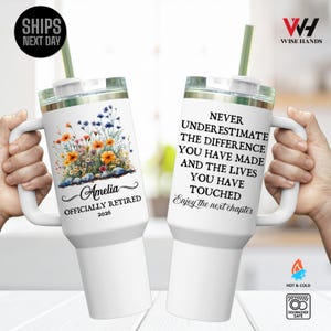 May include: White insulated tumbler with a handle and a straw. One tumbler features a floral design with the name "Amelia" and "Officially Retired 2026." The other tumbler has the text "Never underestimate the difference you have made..." and "Enjoy the next chapter."