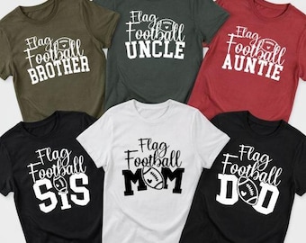 May include: Six short-sleeved t-shirts in olive, dark gray, red, black, and white colors. Each shirt features the text Flag Football with a football graphic and a family title including BROTHER, UNCLE, AUNTIE, SIS, MOM, or DAD in white or black.