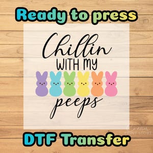 May include: A DTF transfer design with the text "Ready to press" and "DTF Transfer". The design features the phrase "Chillin with my peeps" with six colorful bunny figures in purple, blue, green, yellow, orange, and pink.