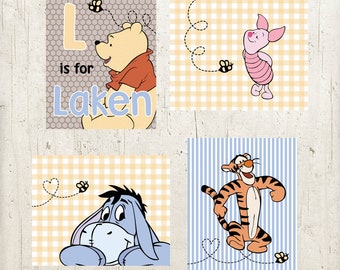 May include: Four Winnie the Pooh themed nursery prints with yellow and white gingham, blue and white stripes, and gray honeycomb patterns. The prints feature Winnie the Pooh, Piglet, Tigger, and Eeyore. The first print says "L is for Laken".