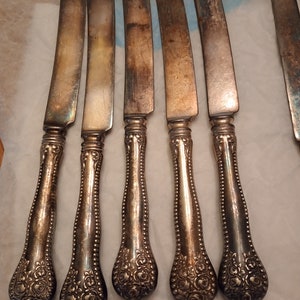 Vintage very ornate silverplate knives