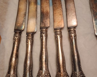 Vintage very ornate silverplate knives