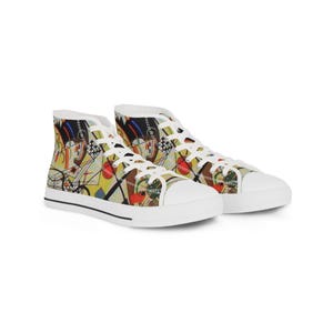 May include: High-top canvas trainers with a colourful abstract design. The shoes have a white rubber toe cap and sole, with a black stripe. The patterned design includes yellow, red, and black elements.