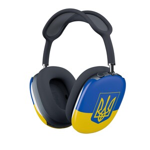 May include: Over-ear headphones featuring a dark gray headband and ear cushions. The outer ear cups display a horizontal blue and yellow flag design with a yellow Ukrainian trident emblem centered on the blue section of each ear cup.