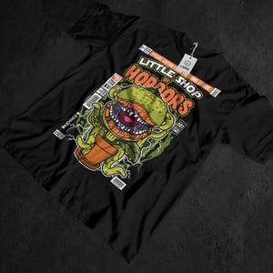 May include: A white ceramic mug with a black handle and the text "But First, Coffee" in a handwritten style. The mug is on a white surface. The mug is approximately 4 inches tall.