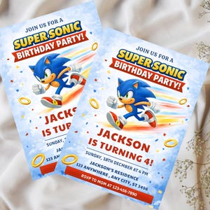 May include: Two blue and white Super Sonic birthday party invitations. Each invitation features the character running with colorful speed lines. Text includes "Super Sonic Birthday Party!" and "Jackson is turning 4!"