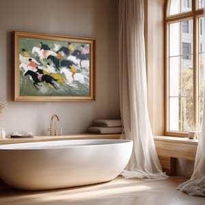 May include: A modern bathroom with a white oval bathtub, a framed painting of horses, and a large window with sheer curtains. The painting features riders on horses in motion. The room has a neutral color palette with wood accents.