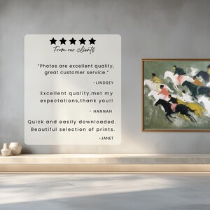 May include: An art print of a horse race with riders in various colors, framed in gold, hangs on a wall. A white sign with customer reviews is to the left. The reviews mention excellent quality and customer service.
