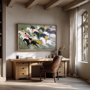 May include: An interior scene featuring a wooden desk, chair, and bookshelf. A framed painting of horses and riders hangs above the desk. The room has large windows with white curtains and a wooden floor.