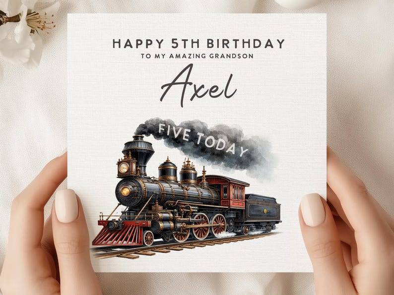 May include: A birthday card with a watercolor illustration of a vintage steam train. The card reads "Happy 5th Birthday to my amazing grandson Axel" with "FIVE TODAY" in the smoke. The train is black, red, and gold.