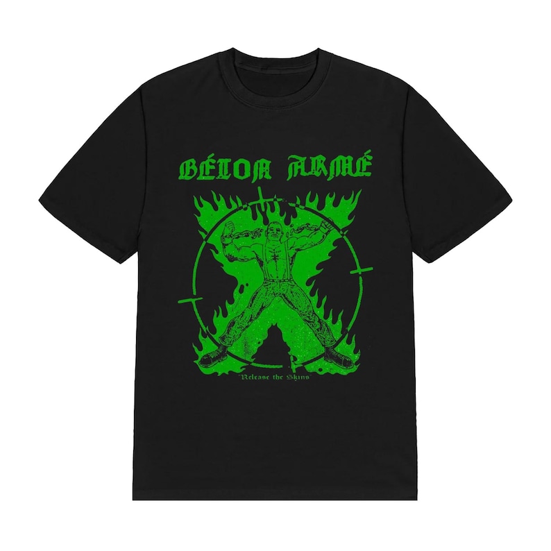 May include: A black short-sleeve t-shirt featuring a bright green graphic print. The design displays the text B&Eacute;TON ARM&Eacute; above a figure inside a circular target frame surrounded by flames, with the text Release the Shine at the bottom.