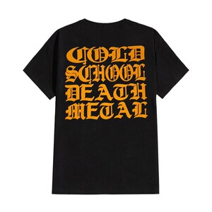 May include: Black t-shirt featuring the orange text "OLD SCHOOL DEATH METAL" in a gothic font. This crew neck tee is a statement piece for fans of old school death metal music.