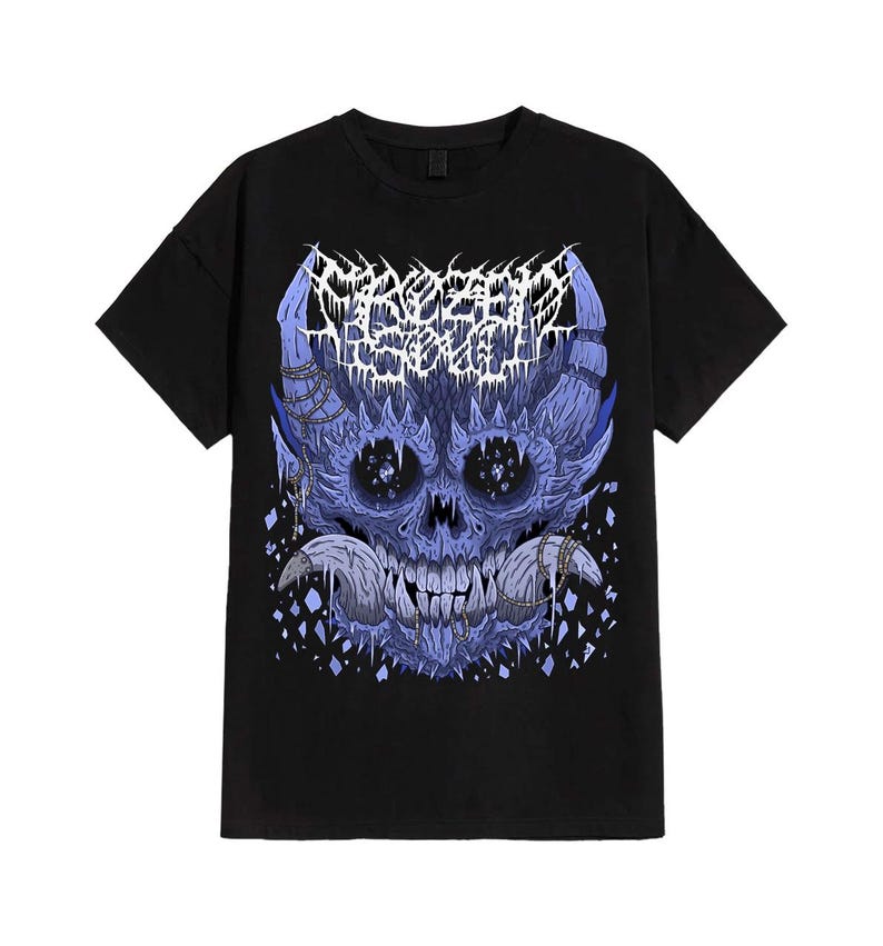 May include: Black t-shirt featuring a detailed, blue and white graphic of a skull with intricate, stylized details. The design includes text at the top and is set against a plain black background. The shirt is a standard crew neck.