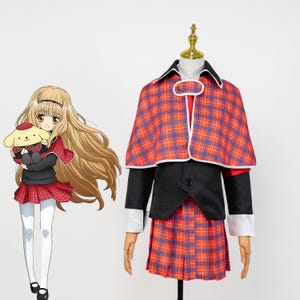 May include: A cosplay outfit featuring a red, blue, and white plaid cape and pleated skirt, paired with a black jacket and white-cuffed sleeves. The outfit is displayed on a mannequin. An anime character illustration is on the left.
