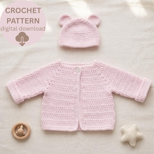 May include: A light pink crochet baby set, comprising a jacket, a hat with bear ears, a wooden rattle, and a star-shaped toy. The set is handmade and features a button closure on the jacket. The image includes the text "CROCHET PATTERN digital download".