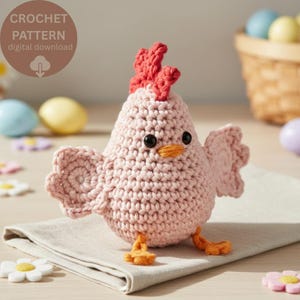 May include: A light pink crocheted chicken toy with a red comb, orange beak, and orange feet. The chicken has black bead eyes and outstretched wings. A circular brown badge in the upper left corner displays the text CROCHET PATTERN digital download.